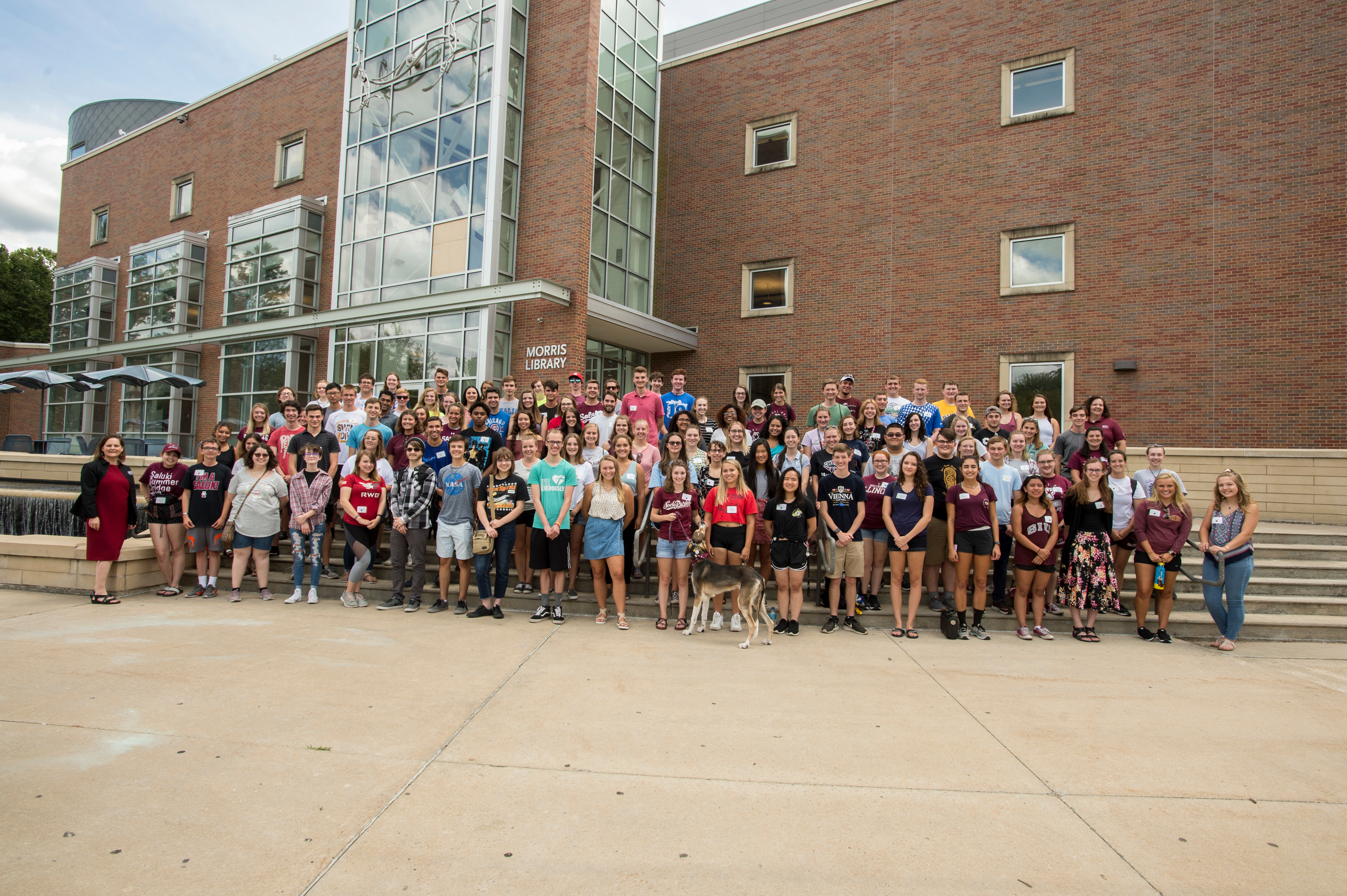 Incoming Class posed outside Morris Library