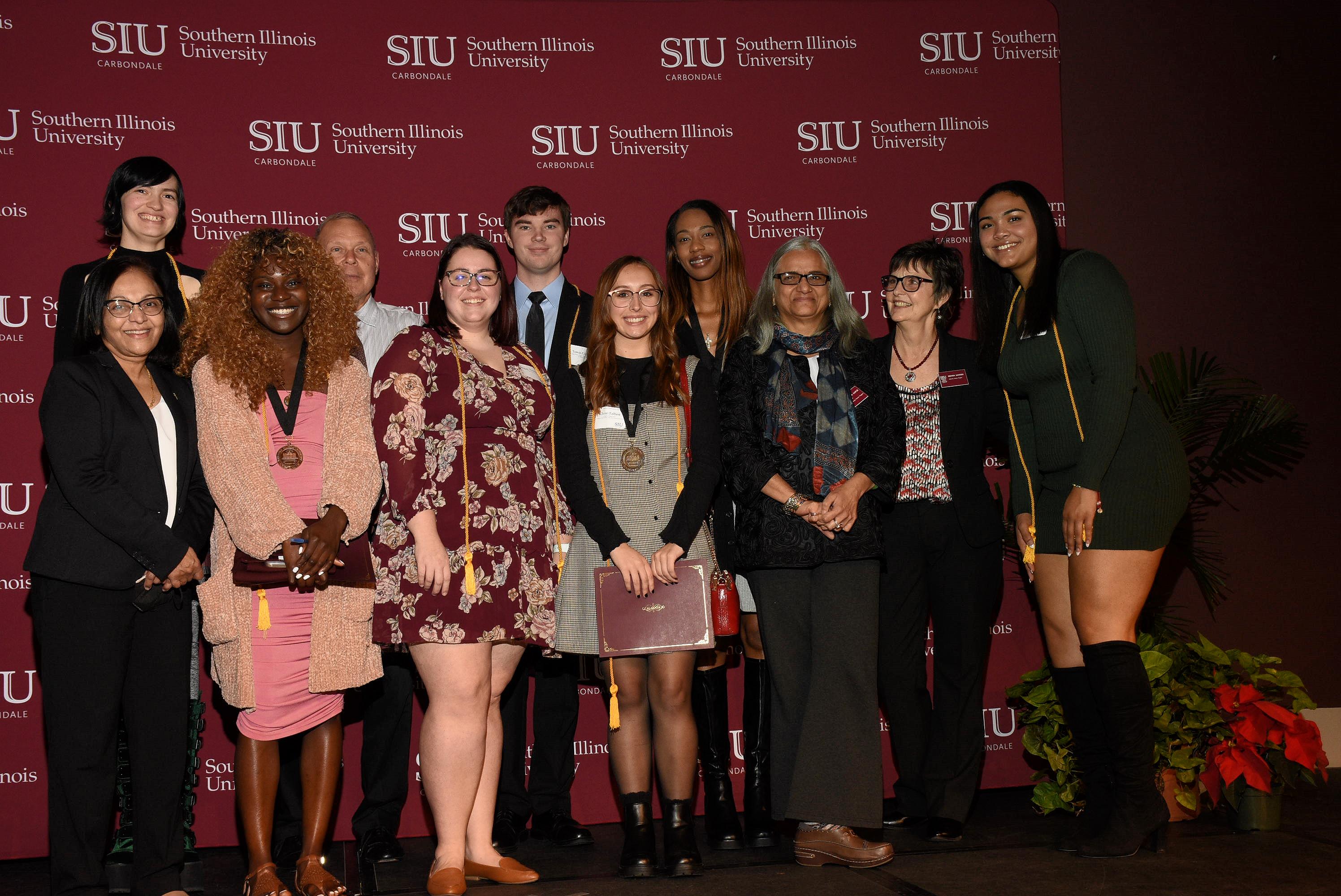 Groups of December 2022 graduates at Excellence Ceremony