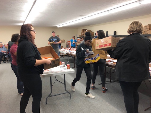 Students volunteering at Gum Drops