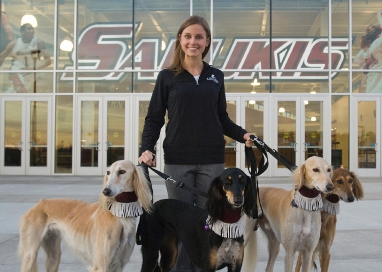 Jessica Stout with Saluki dogs in front of Banterra Center