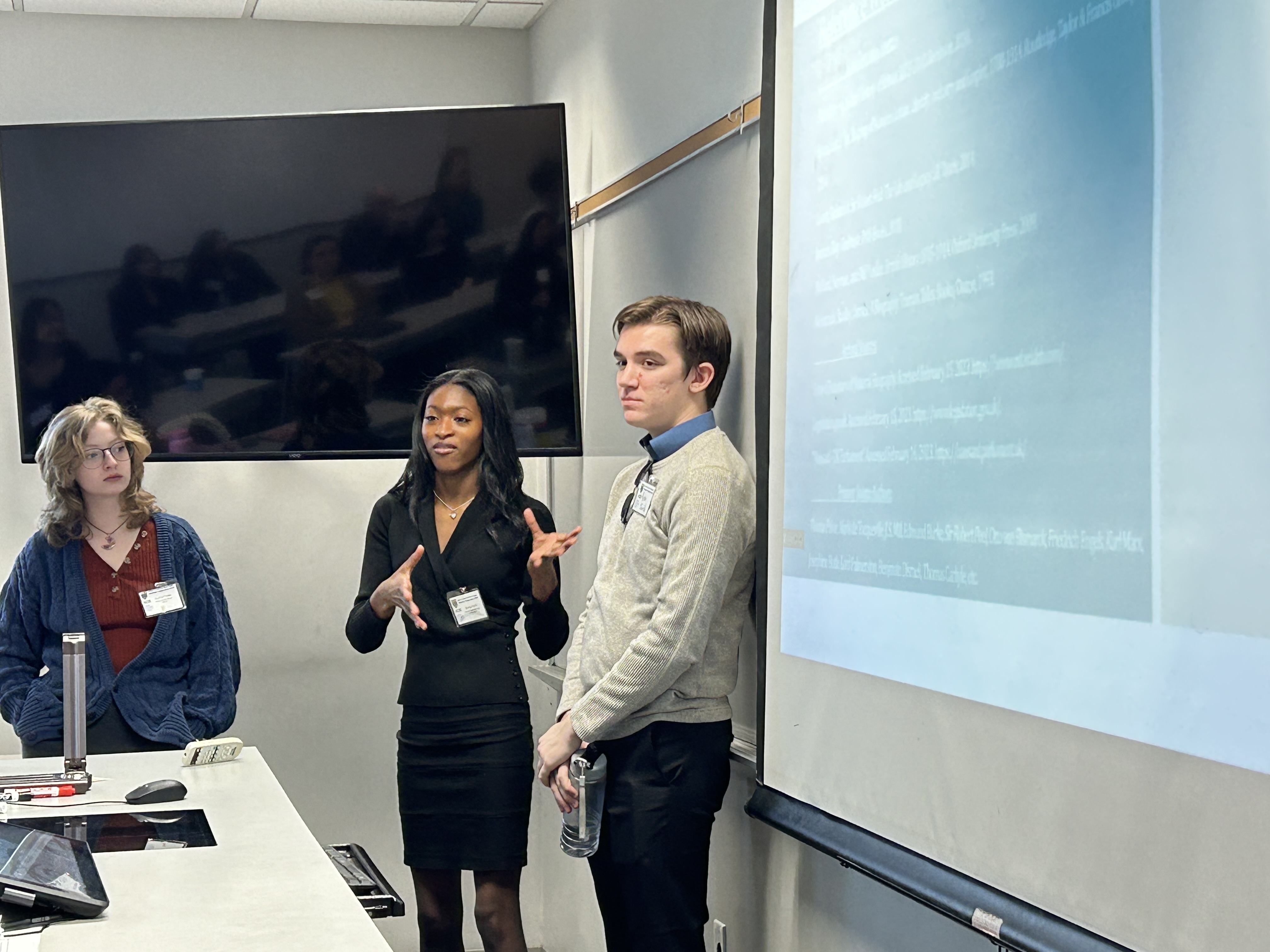 Zeneya Scott and Ryan Jurich present at symposium